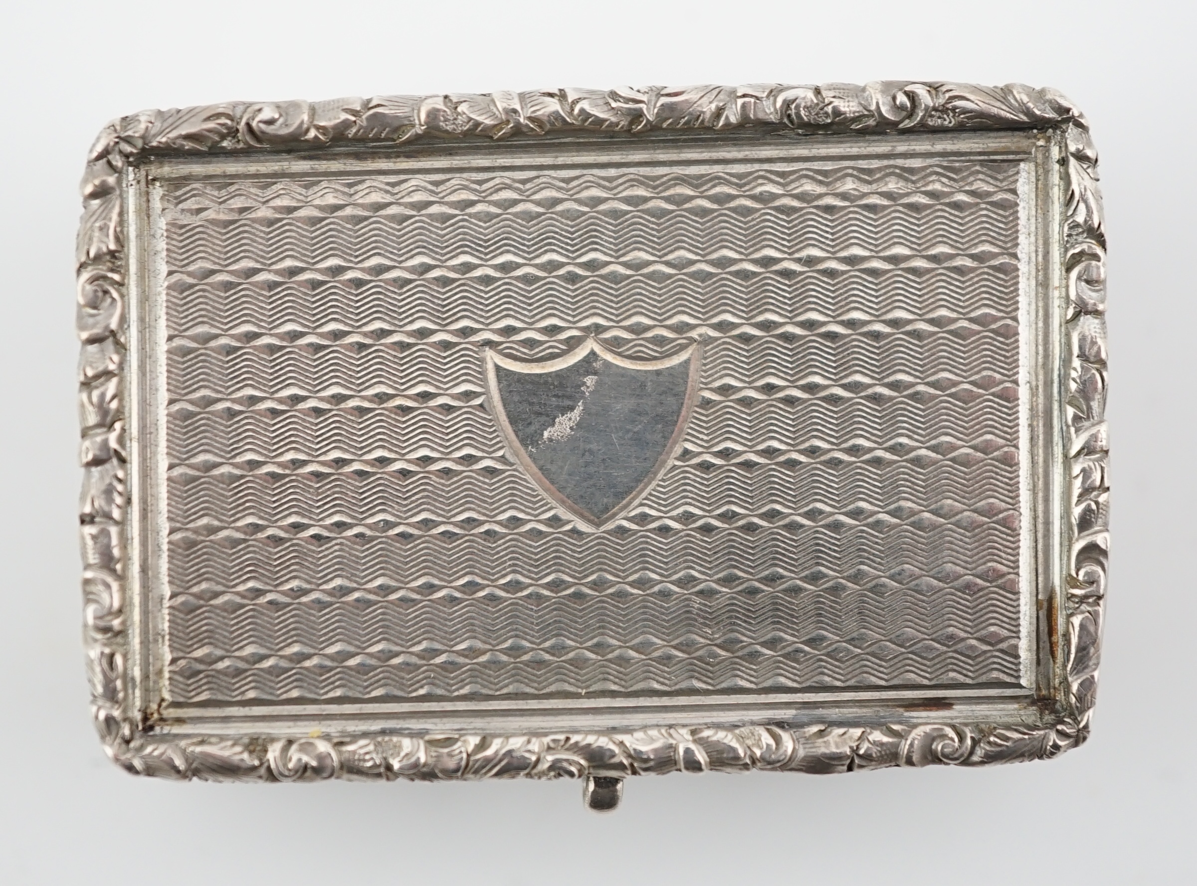 A George IV engine turned silver castle top rectangular vinaigrette, by Francis Clark, depicting ‘Kenilworth Castle’ in relief